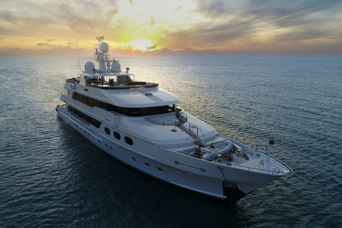 Motor yacht at anchor at sunset