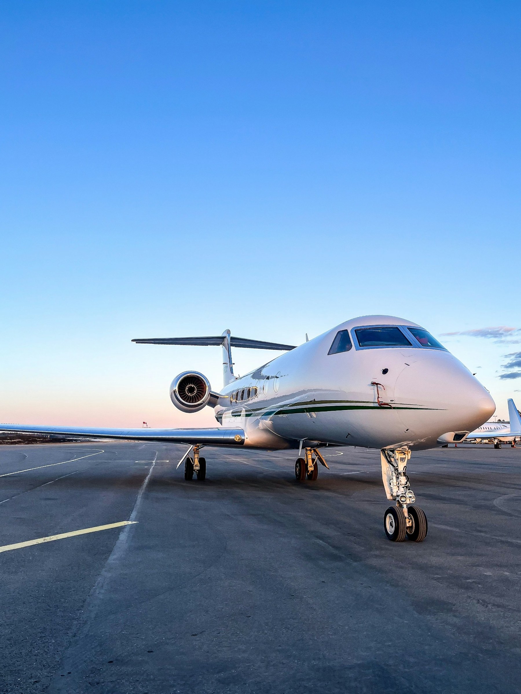Large private jet on the apron at dusk